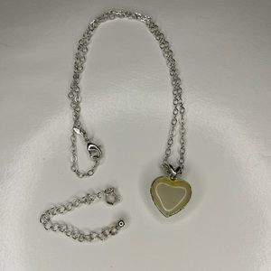 Avon silver heart dainty with cream stone pendant.